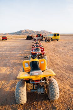 A lineup of ATVs in the Las Vegas desert awaits an off-road adventure tour.